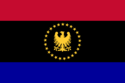 A red-black-gold tricolour with the Tumbran eagle and the twenty-five stars surrounding it.